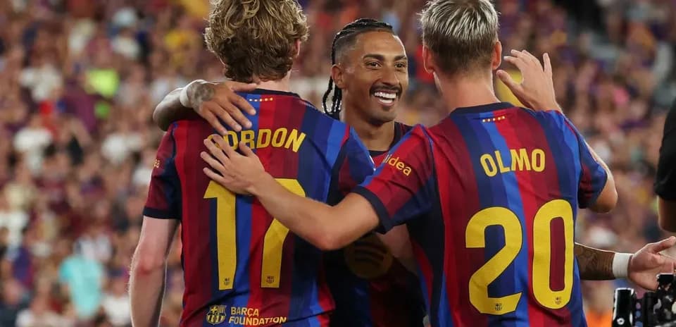 Barcelona players celebrating a goal on the field