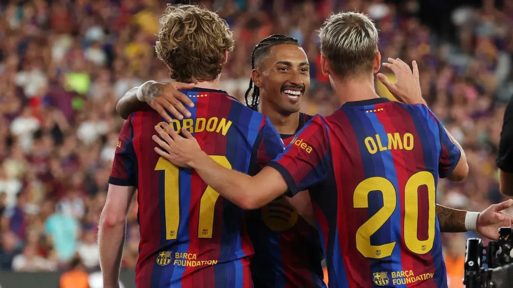 Barcelona players celebrating a goal on the field
