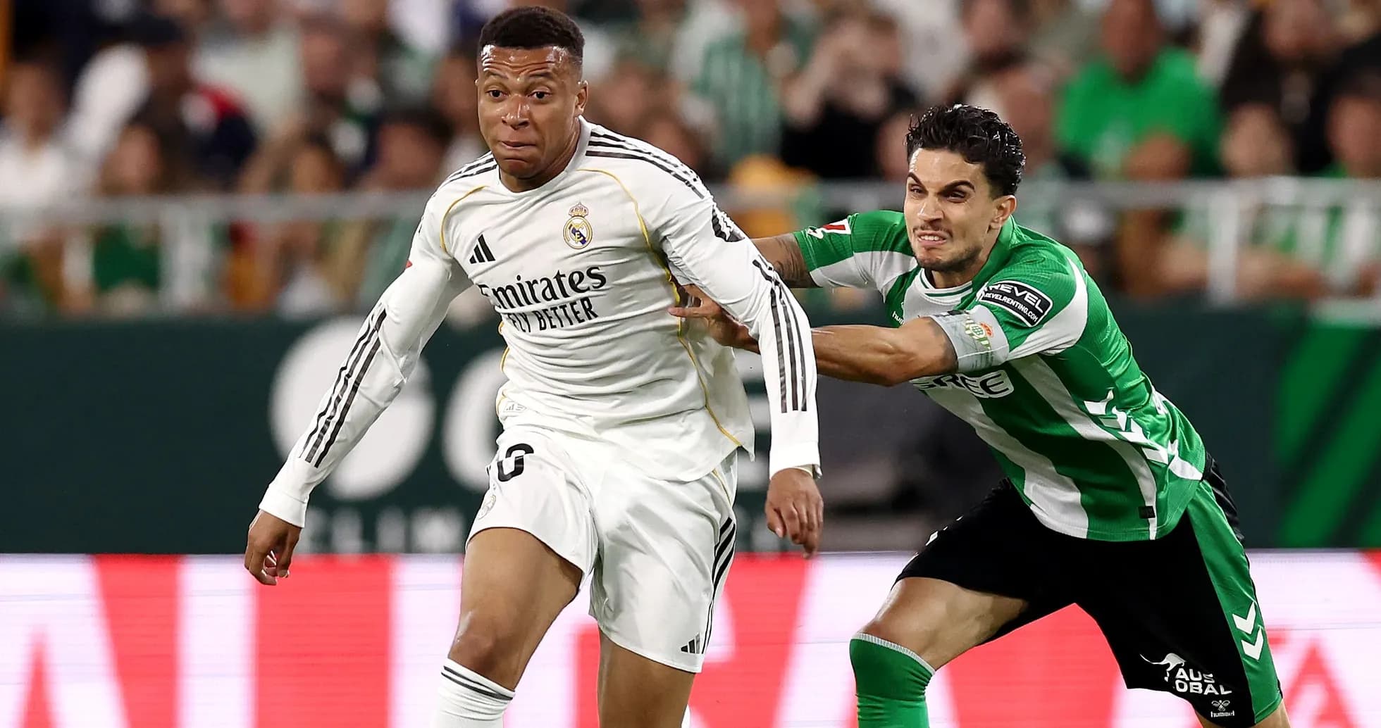 Player from Real Madrid evading an opponent during match