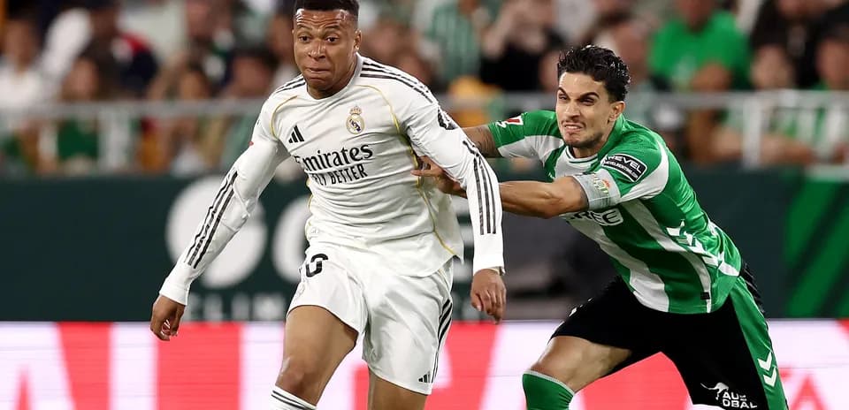 Player from Real Madrid evading an opponent during match