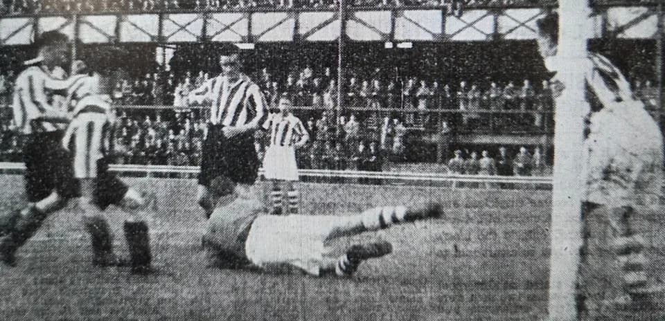 Players contesting during a historic football match