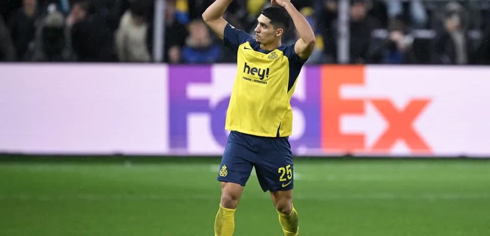 Player celebrating during a match with fans