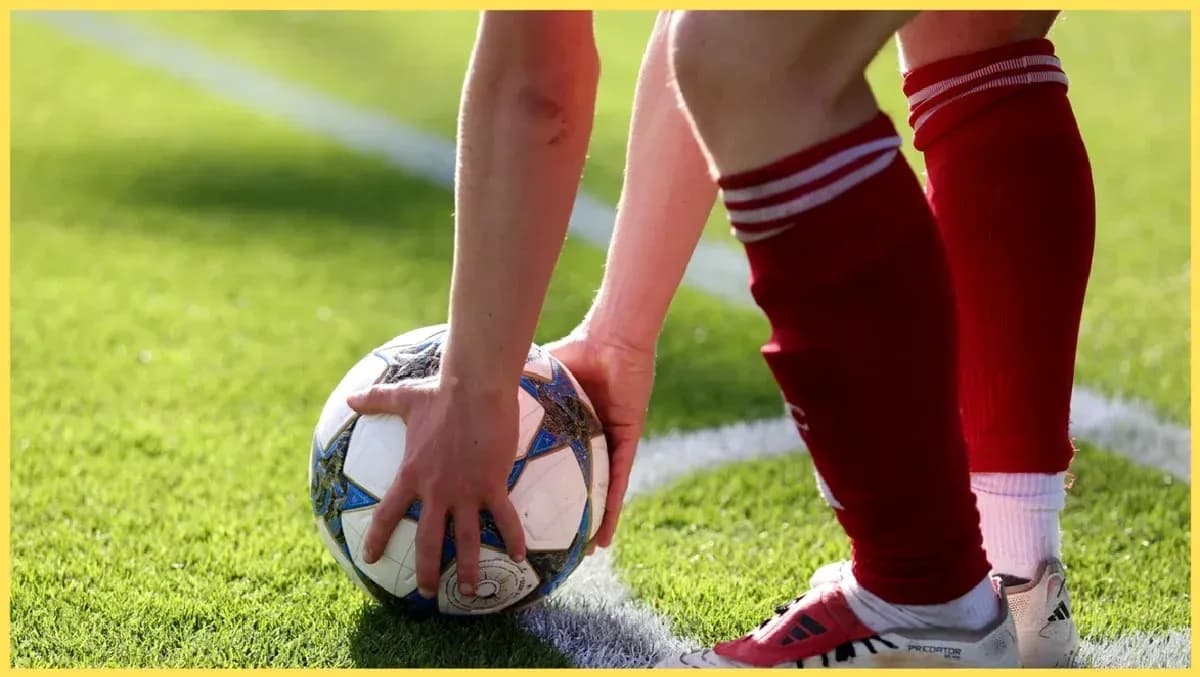Player preparing to take a throw-in with soccer ball