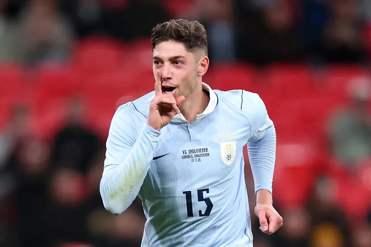 Player celebrating with a shushing gesture after scoring