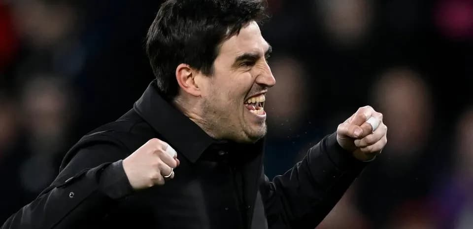 Coach celebrating passionately during a match