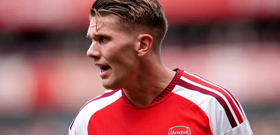 Player in Arsenal kit during match action