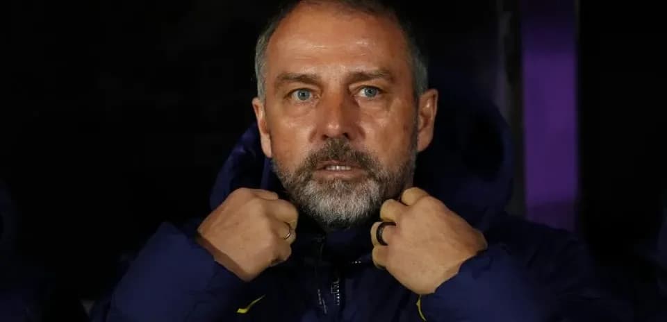 Coach adjusting jacket on the sidelines