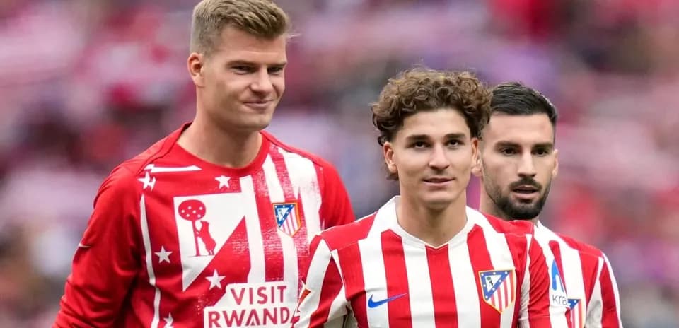 Three Atlético Madrid players in team jerseys