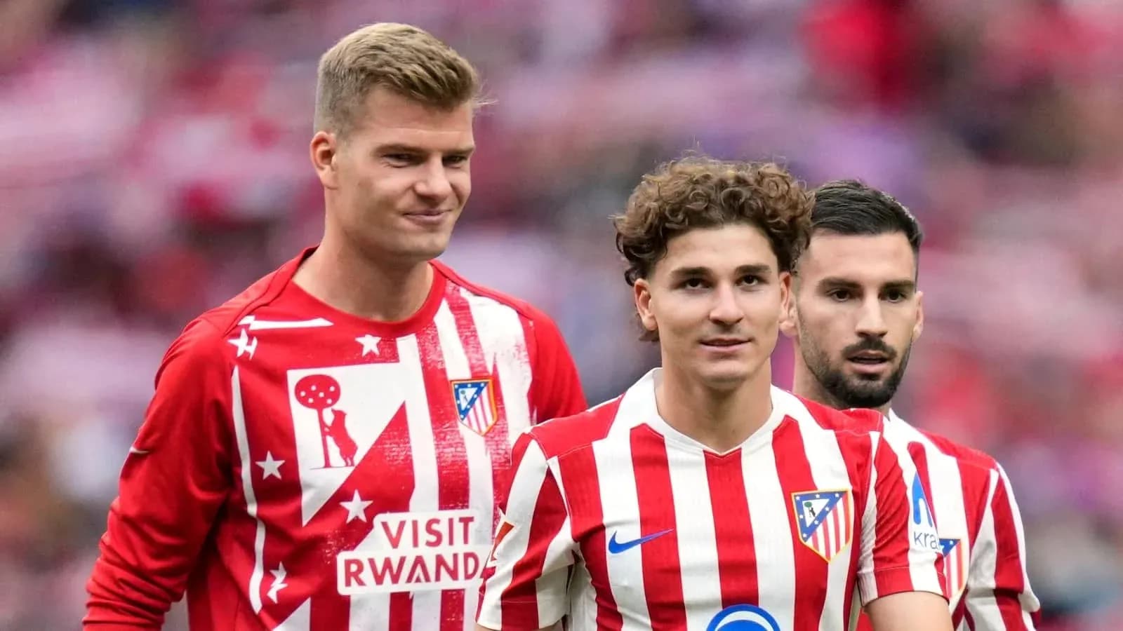 Three Atlético Madrid players in team jerseys