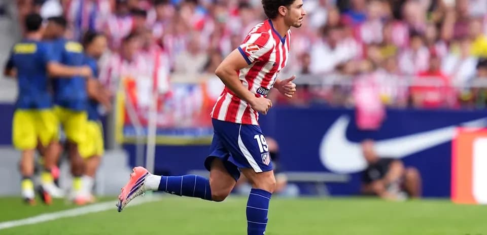 Atletico Madrid player running on the pitch