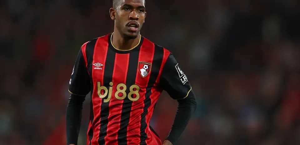 Player in Bournemouth's black and red striped jersey