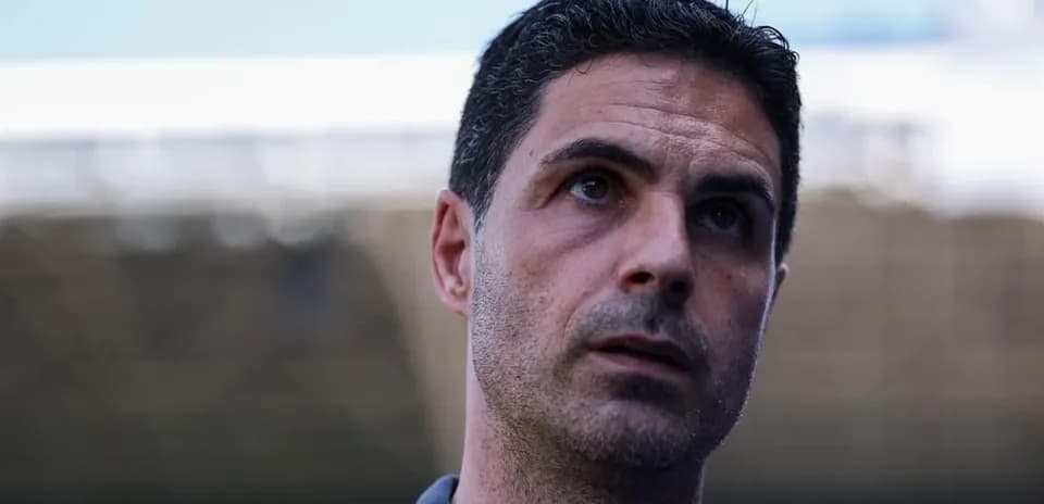 Manager speaking during a press conference outdoors