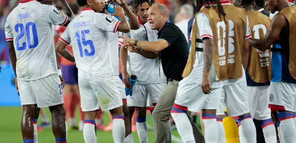 Haiti team discussing strategy during a match