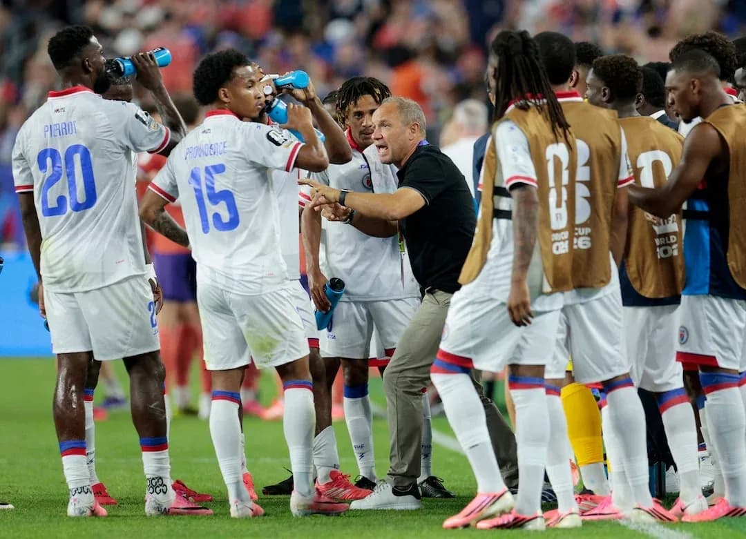 Haiti team discussing strategy during a match