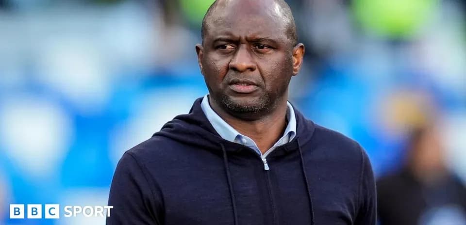 Coach observing the match from the sidelines
