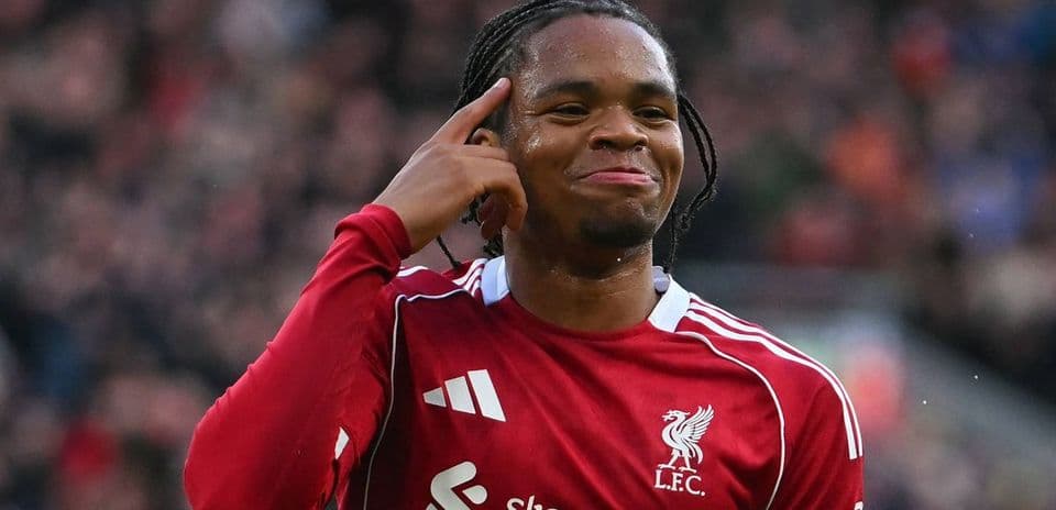 Player celebrating and pointing to head after goal