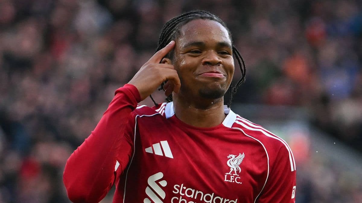 Player celebrating and pointing to head after goal