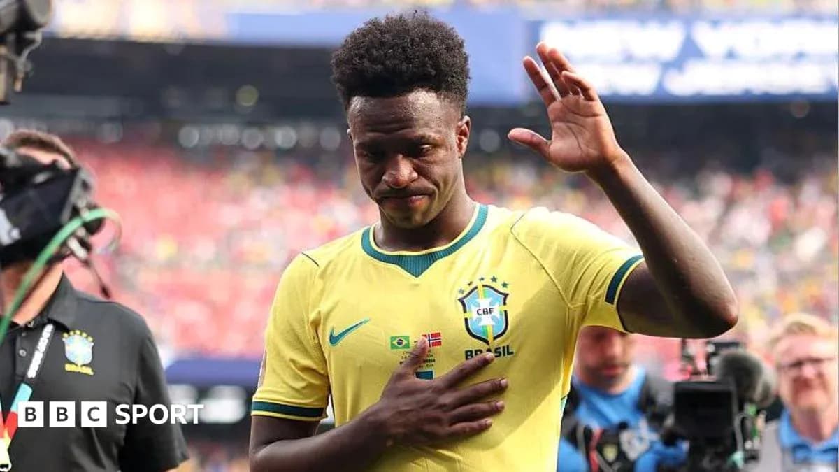 Player in Brazil jersey waving during match exit