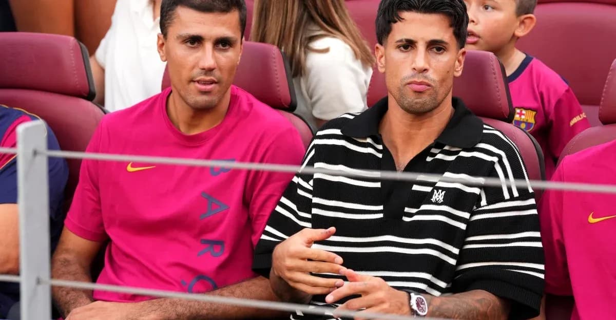 Two men sitting in stadium seats during event