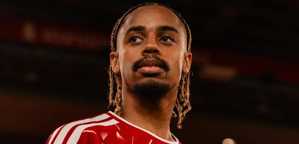 Player wearing red jersey looking off-camera
