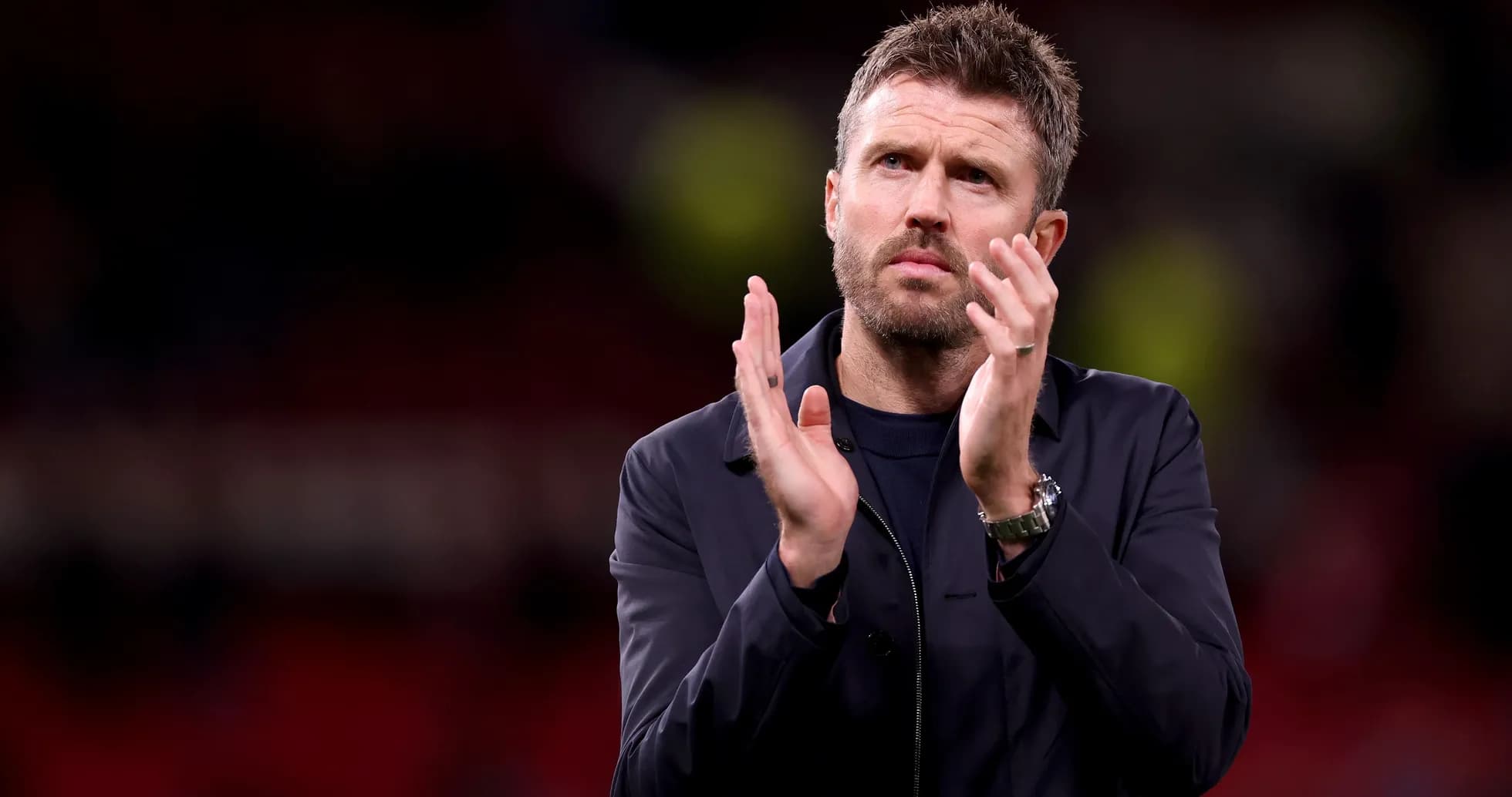 Manager applauding fans after the match