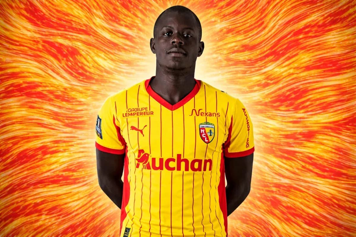 Player in yellow and red team jersey posing