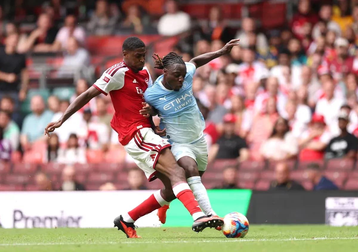 Two players battling for the ball during match