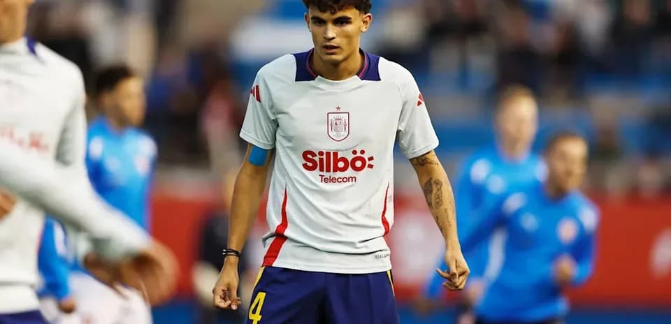 Player in Spain kit during warm-up on field