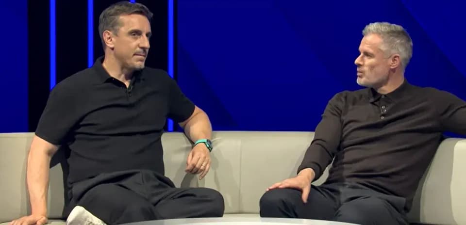 Two analysts discussing on a studio couch