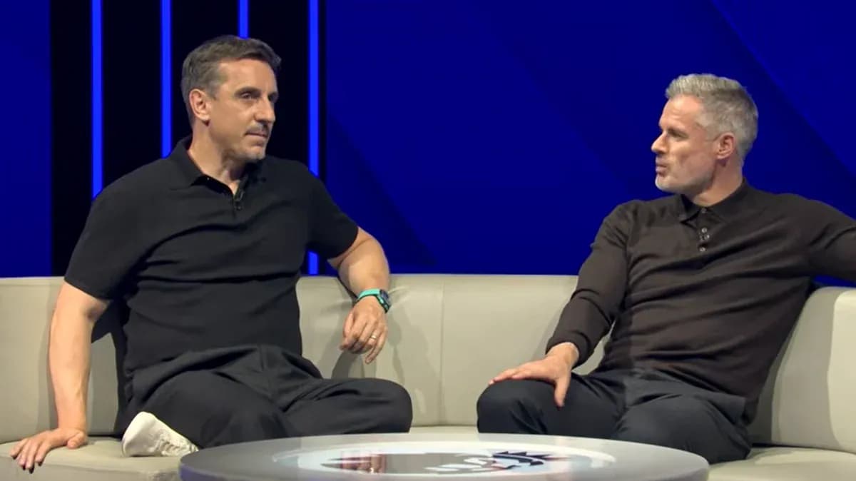 Two analysts discussing on a studio couch