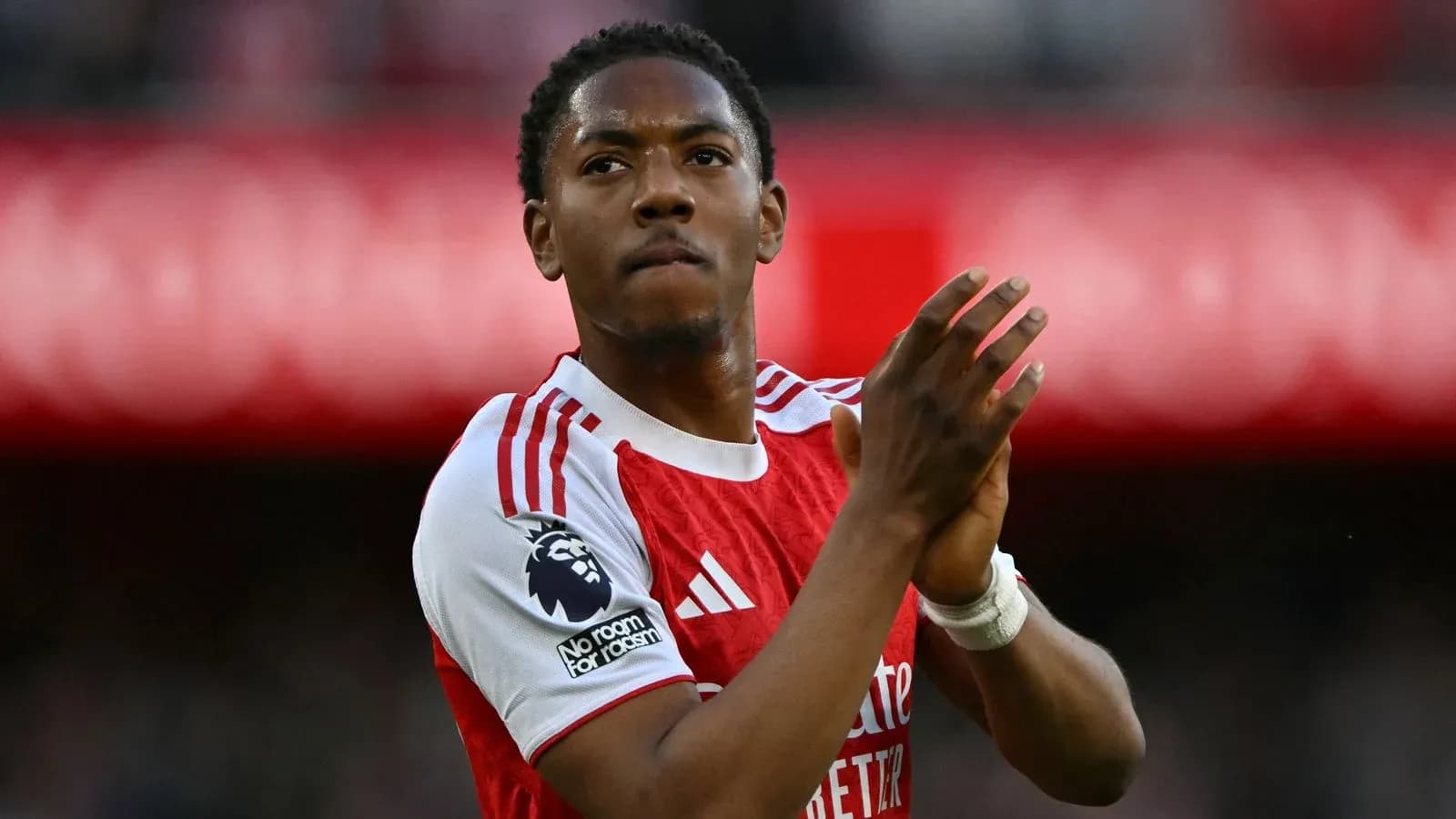Player applauding fans after the match