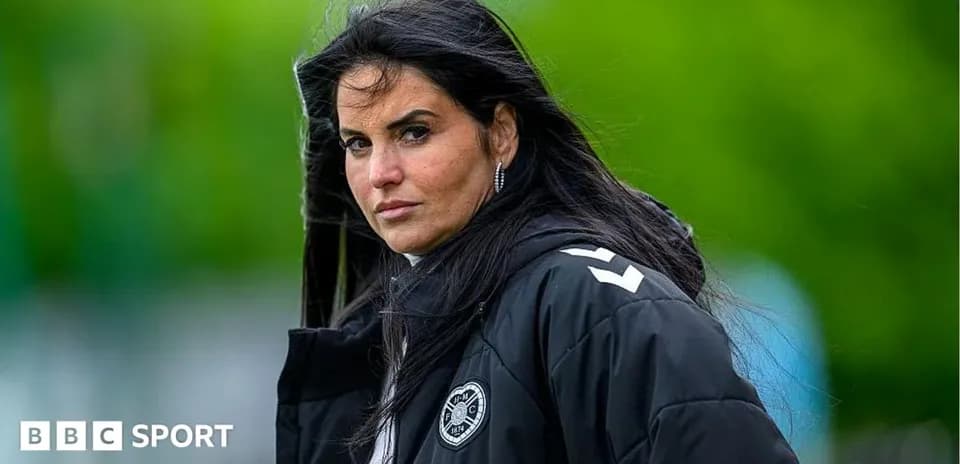 Coach observing training session with focused expression