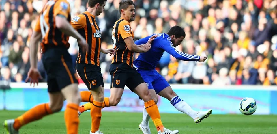 Chelsea player attempting to shoot against Hull City