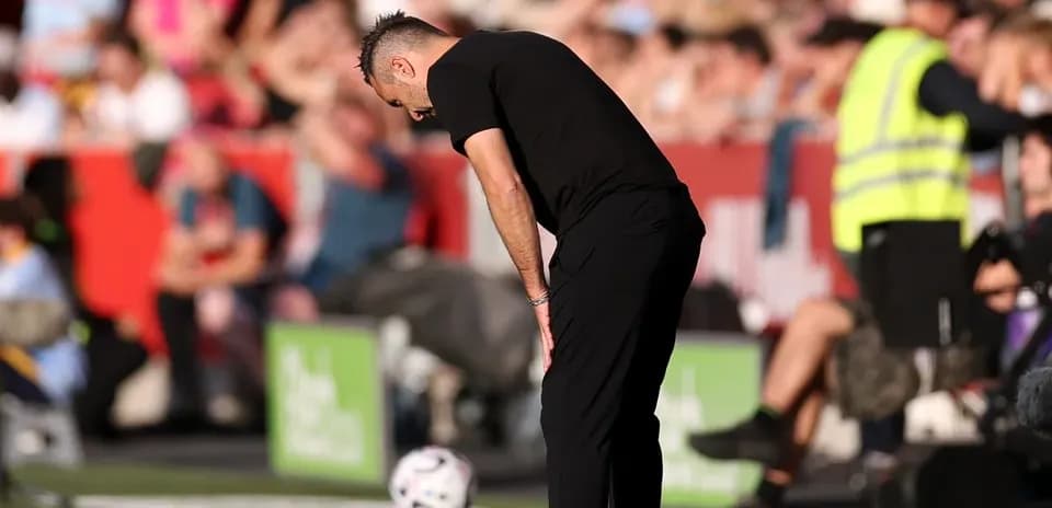 Coach observing the match from the sidelines