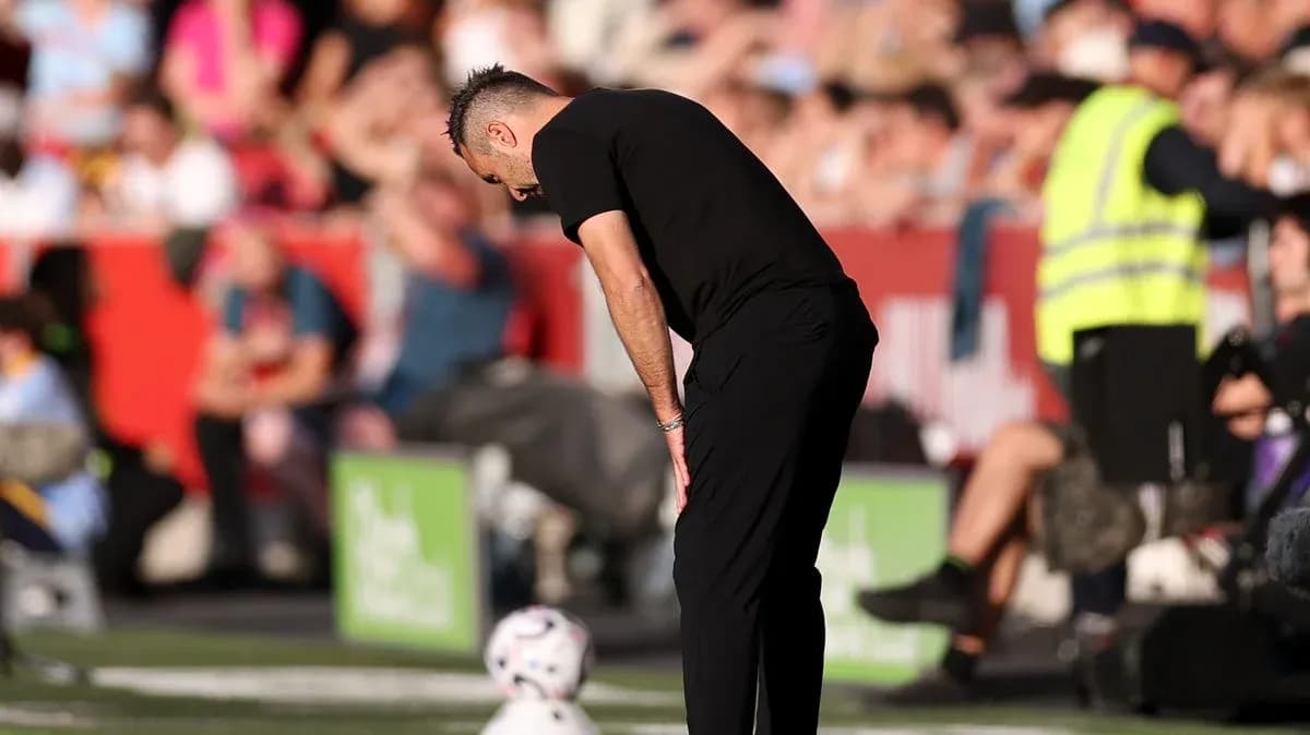 Coach observing the match from the sidelines