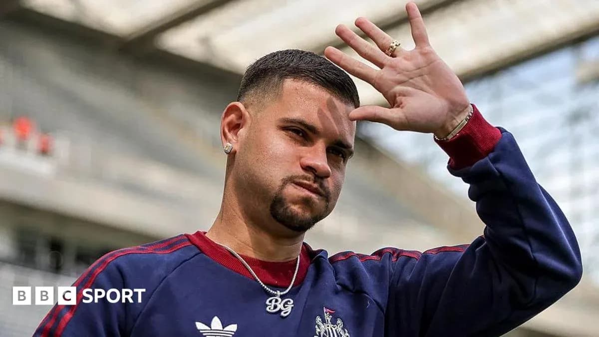 Player waving during training session at stadium