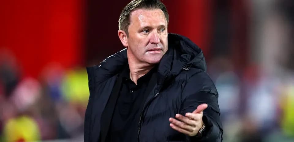 Coach gesturing during a football match