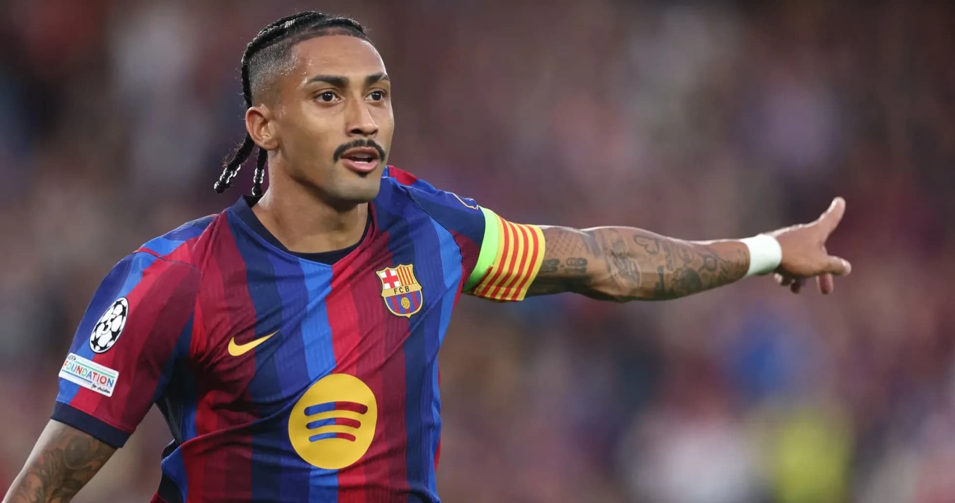 Player gesturing during match in Barcelona jersey