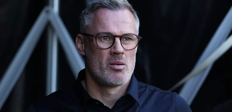 Man with glasses looking serious in dark setting