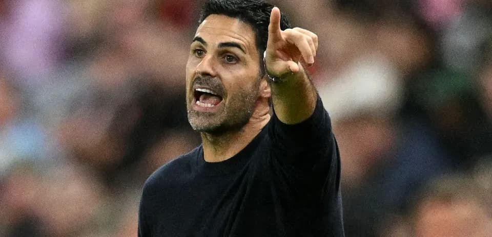Manager instructing players from the sidelines