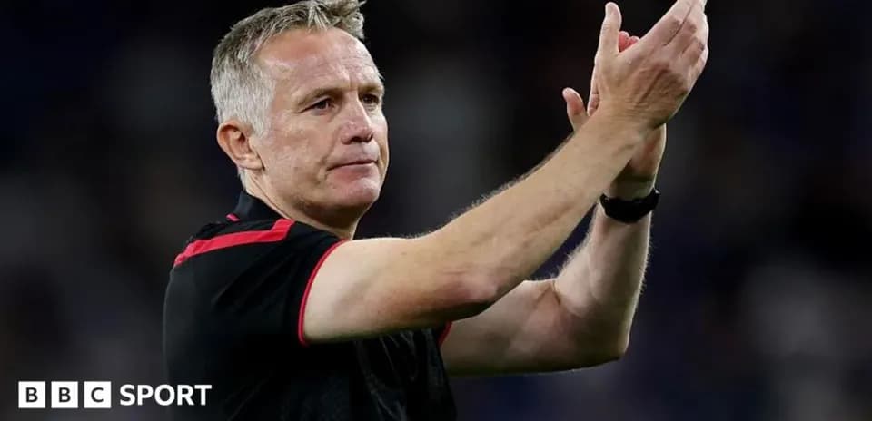 Coach applauding fans after match conclusion