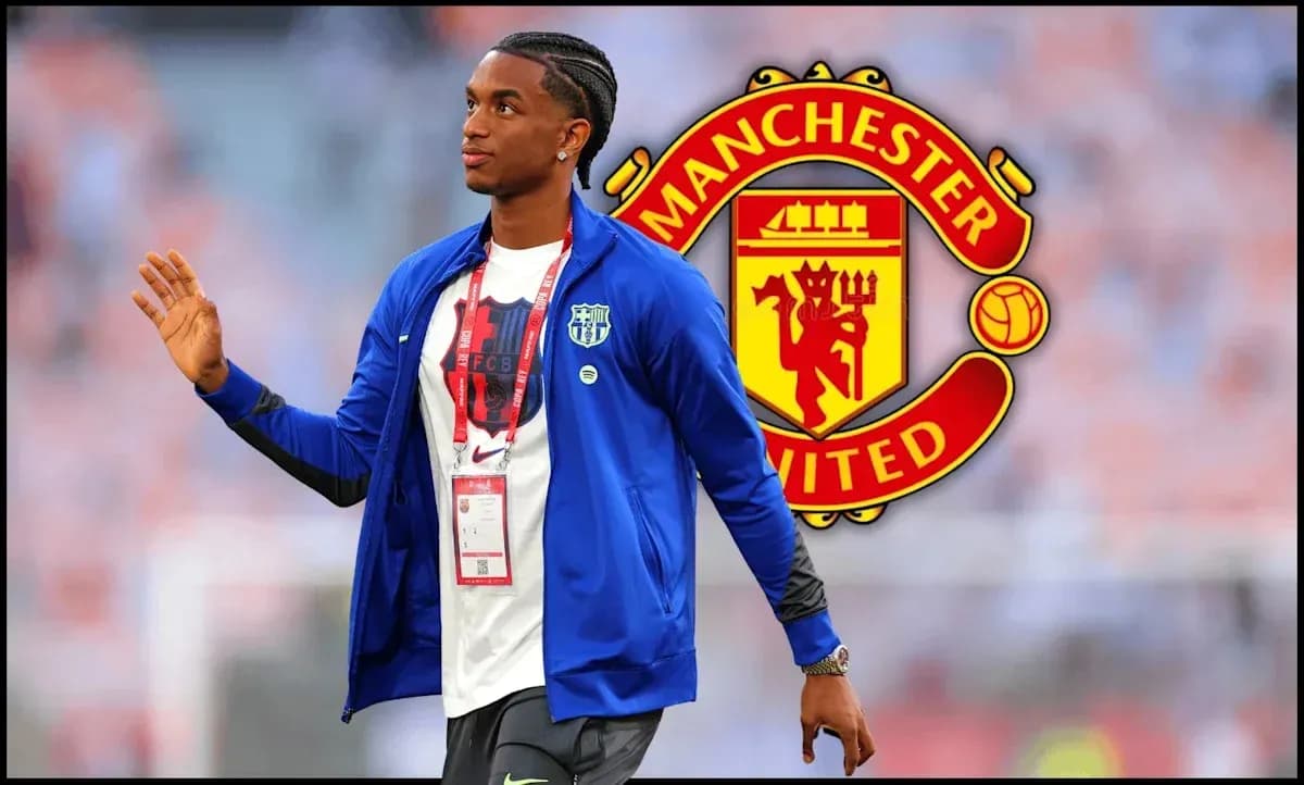 Player walking in front of Manchester United logo
