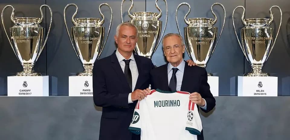 José Mourinho holding jersey with club president Florentino Pérez
