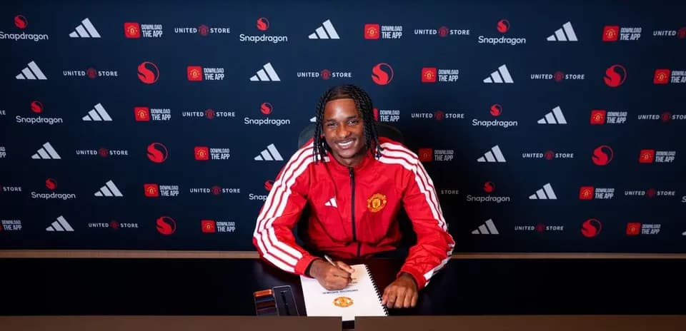 Player signing contract at Manchester United press conference