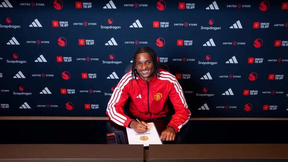 Player signing contract at Manchester United press conference