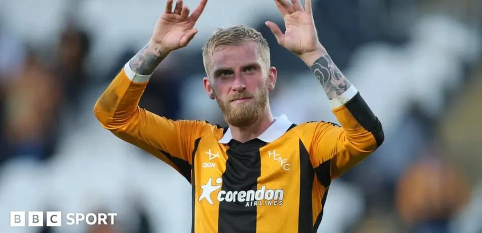 Player waving to fans after the match