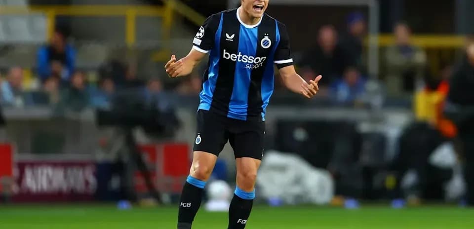 Player gesturing during a Champions League match