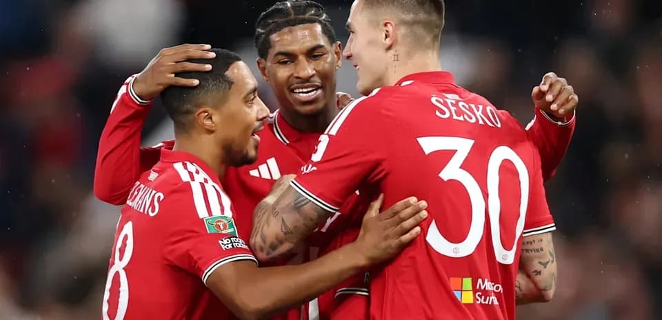 Players celebrating a goal during match