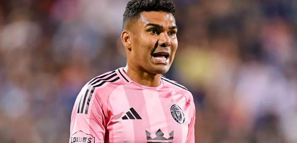 Player in pink jersey speaking during match