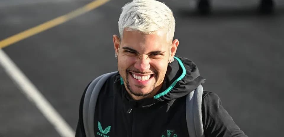 Player smiling while wearing Newcastle training jacket